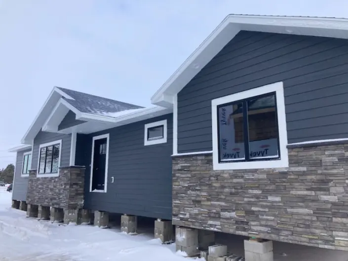 Redi-Built home on the builder’s lot in Watertown SD with stone exterior accents