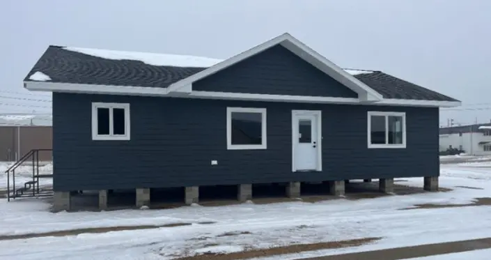Redi-Built Home with Covered Front Porch Custom Redi-Built home with gray siding and covered front porch in Watertown, SD